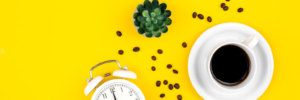 alarm-clock-cup-of-coffee-and-coffee-beans-on-a-y-2023-11-27-05-26-17-utc